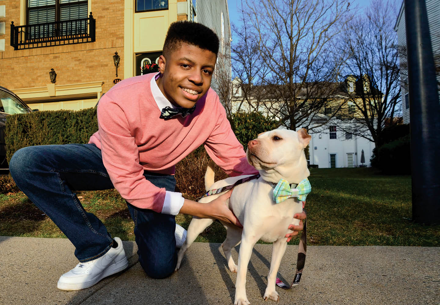 Image of teen posing with small dog